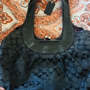 Black Coach signature clutch handbag